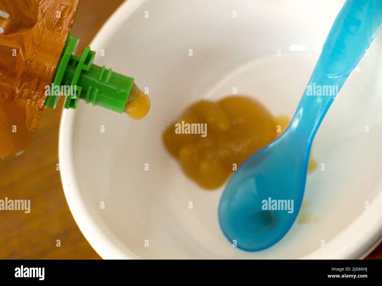 File photo dated 04/09/15 of baby food being poured into a bowl. Many popular baby food pouches are more sugary than Coca-Cola, dentists have warned, amid an 'epidemic' of tooth decay among young children. Issue date: Friday July 8, 2022. Stock Photo