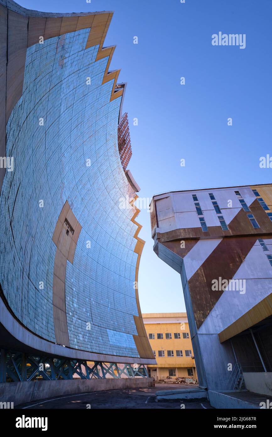 The curved concentrator mirror of the giant reflector  at the Physics of the Sun Institute of Physics and Technology. In Parkent, near Tashkent, Uzbek Stock Photo
