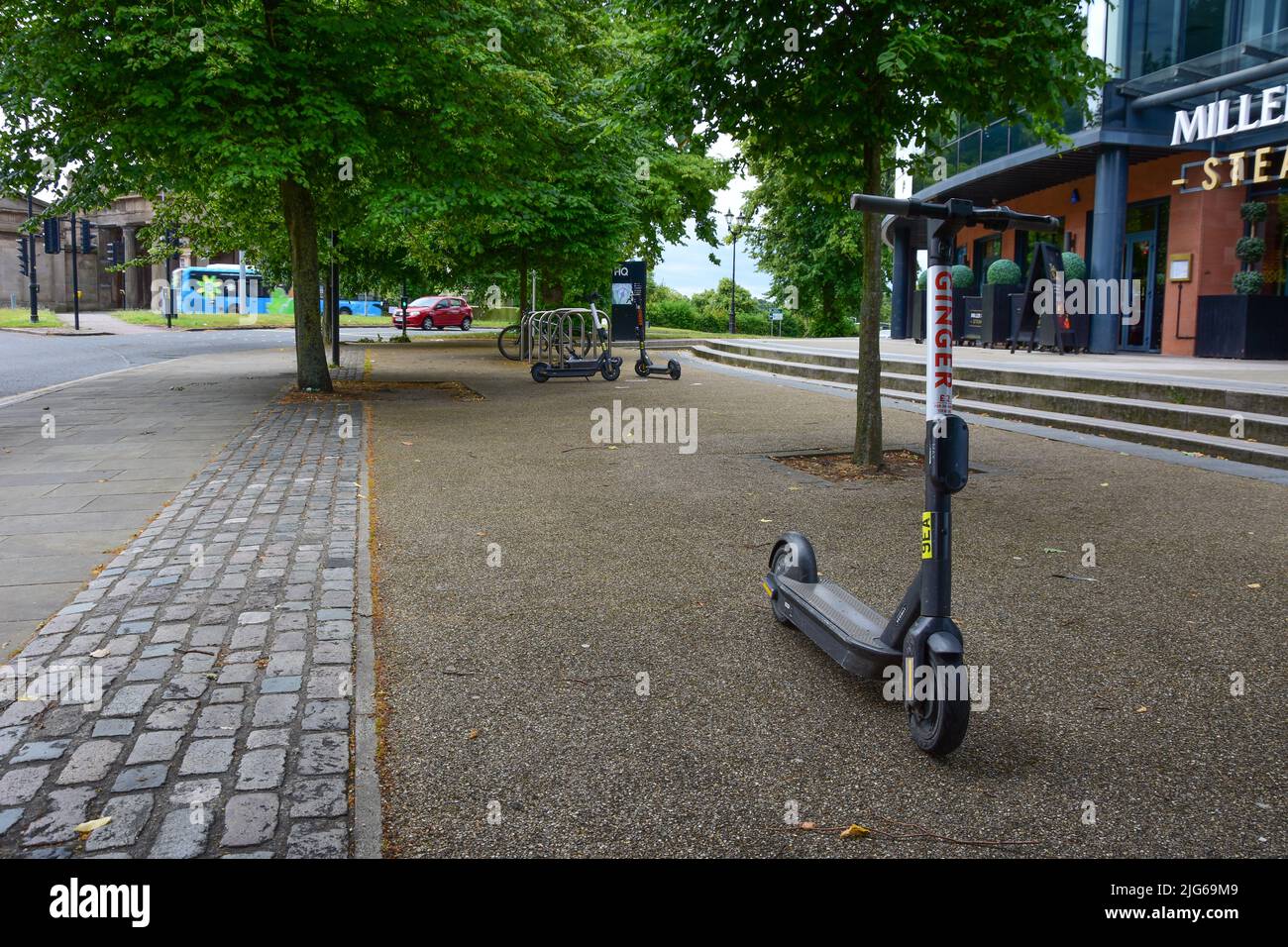 Chester, UK: Jul 3, 2022: A Ginger electric scooter awaits being hired Stock Photo