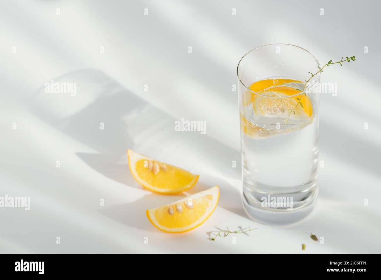Glass of clean mineral sparkling water with ice and lemon Stock Photo ...