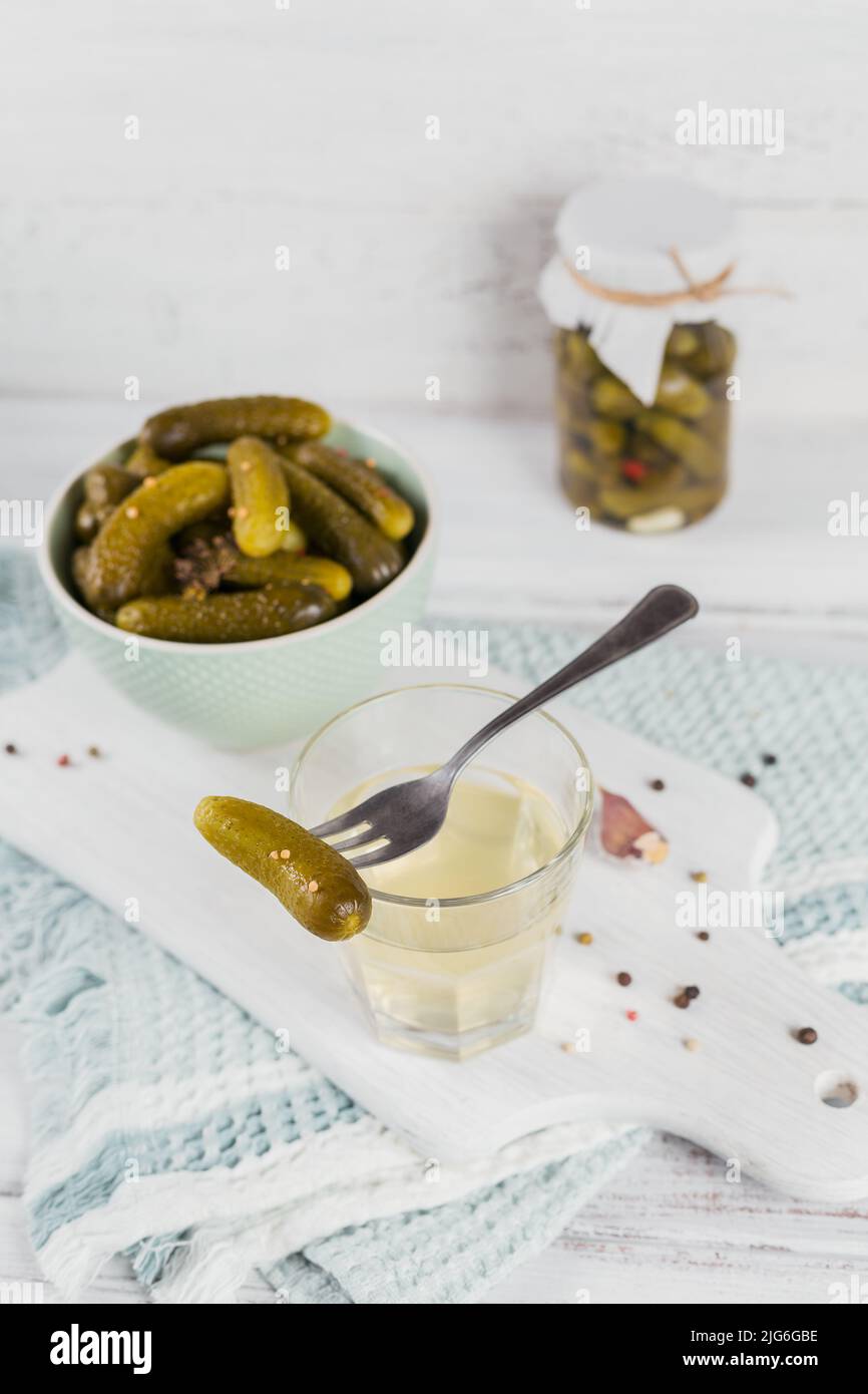 Pickled juice, pickle and marinated cucumber in bowl Stock Photo Alamy