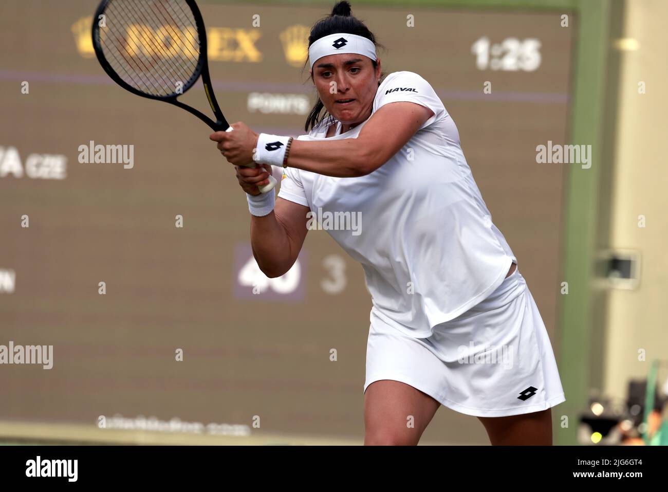 5 July 2022, All England Lawn Tennis Club, Wimbledon, London, United Kingdom:  Tunisia's Ons Jabeur strikes a backhand return to Marie Bouzkova of the Czech Republic during their quarterfinal match at Wimbledon today.  Jabeur won the match to advance to the semi finals. Stock Photo
