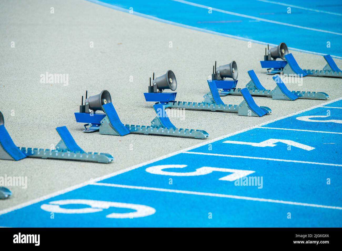 Starting blocks for Track and Field sprinting events. Sport photo, blue