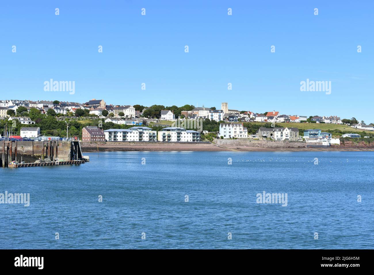 View across the water to the eastern end of Milford Haven town from Mackerel Quay, Milford Haven, Pembrokeshire, Wales Stock Photo
