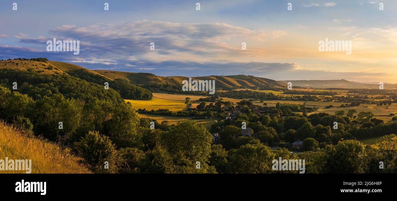 Beautiful views west over the village of Poynings from Devils Dyke to Chanctonbury ring on the south downs in west Sussex south east England UK Stock Photo