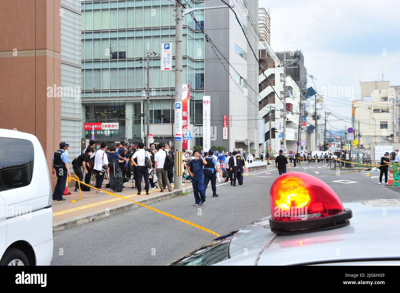 Abe Shot Police officers investigate the scene where Japan's former Prime ...