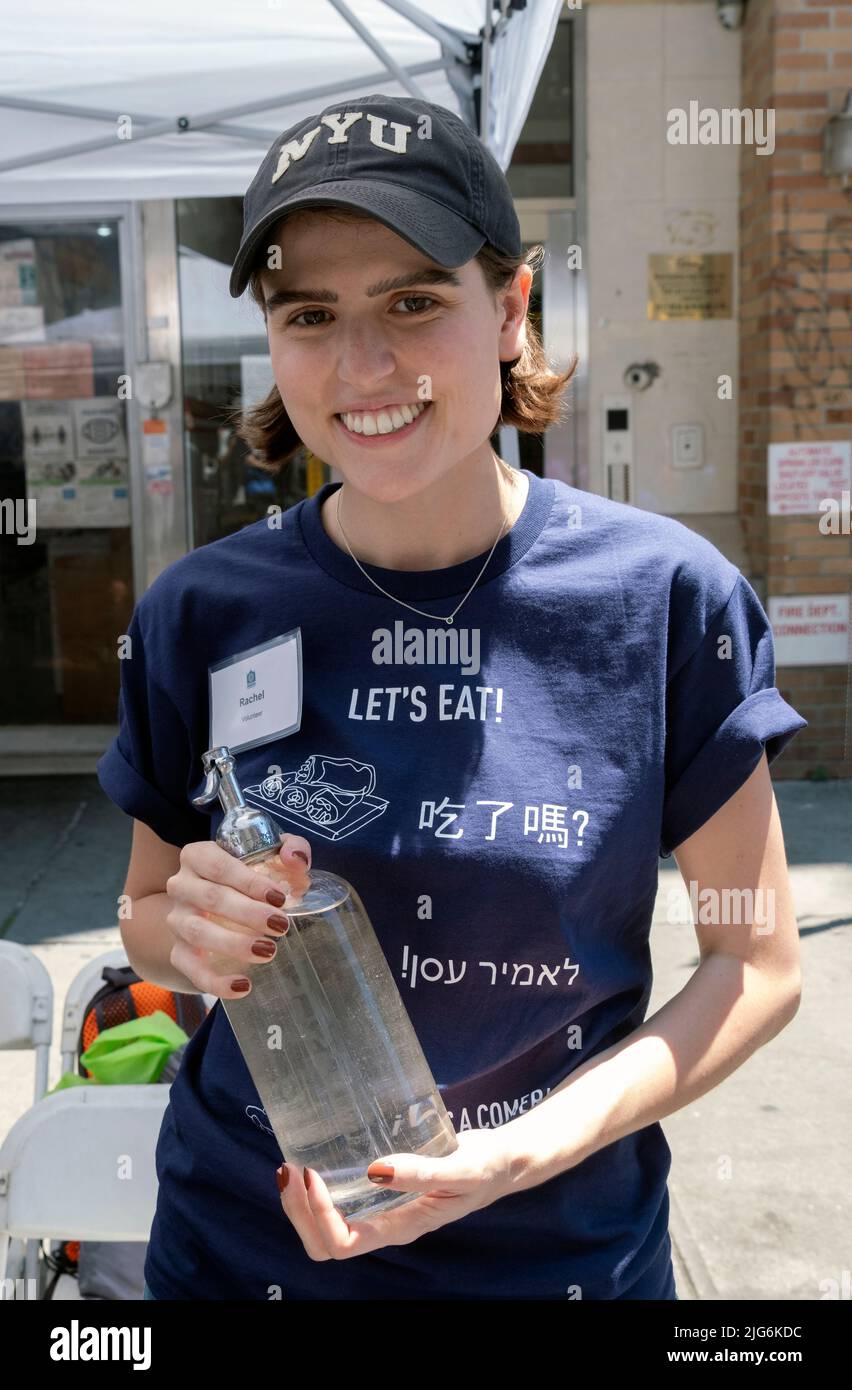 A young lady serving egg creams at the Egg Rolls, Egg Creams, and Empanadas Street Festival on Eldridge Street in Lower Manhattan. Stock Photo