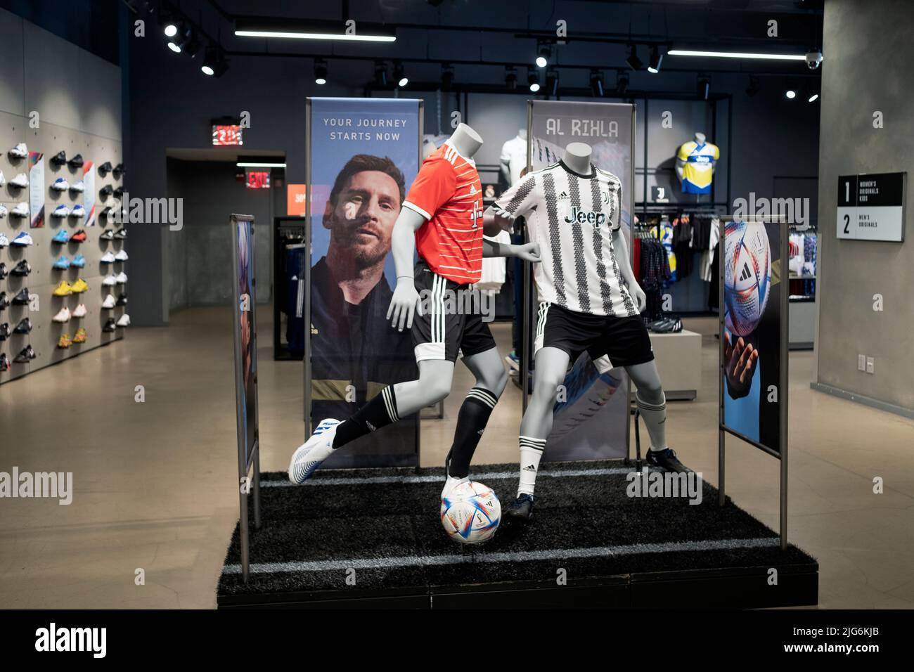 The soccer section of the Adidas store on Broadway in Manhattan featuring a Juventus jersey & a photo of the great Lionel Messi. on Broadway in NYC. Stock Photo