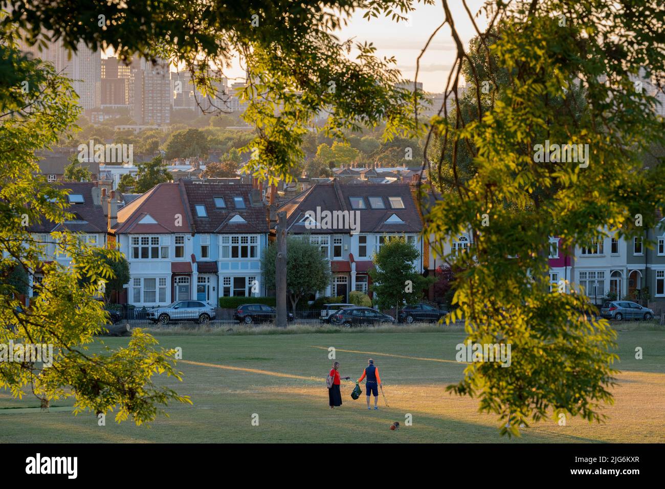 Members of the local community pick up litter on a summer's afternoon in Ruskin Park, a south London green space in Lambeth, on 5th July 2022, in London, England. Stock Photo