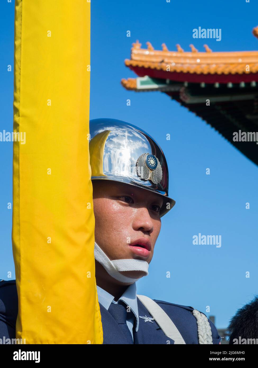 Taipei, Taiwan - October 02, 2016: Soldier wearing shining helmet with a  reflection of the building National Theatre on it Stock Photo