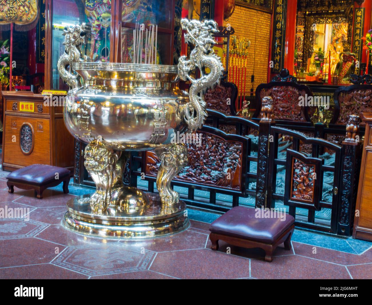 Taipei, Taiwan - October 2016: Golden censer and praying people in a temple in Taiwan. Asia Stock Photo