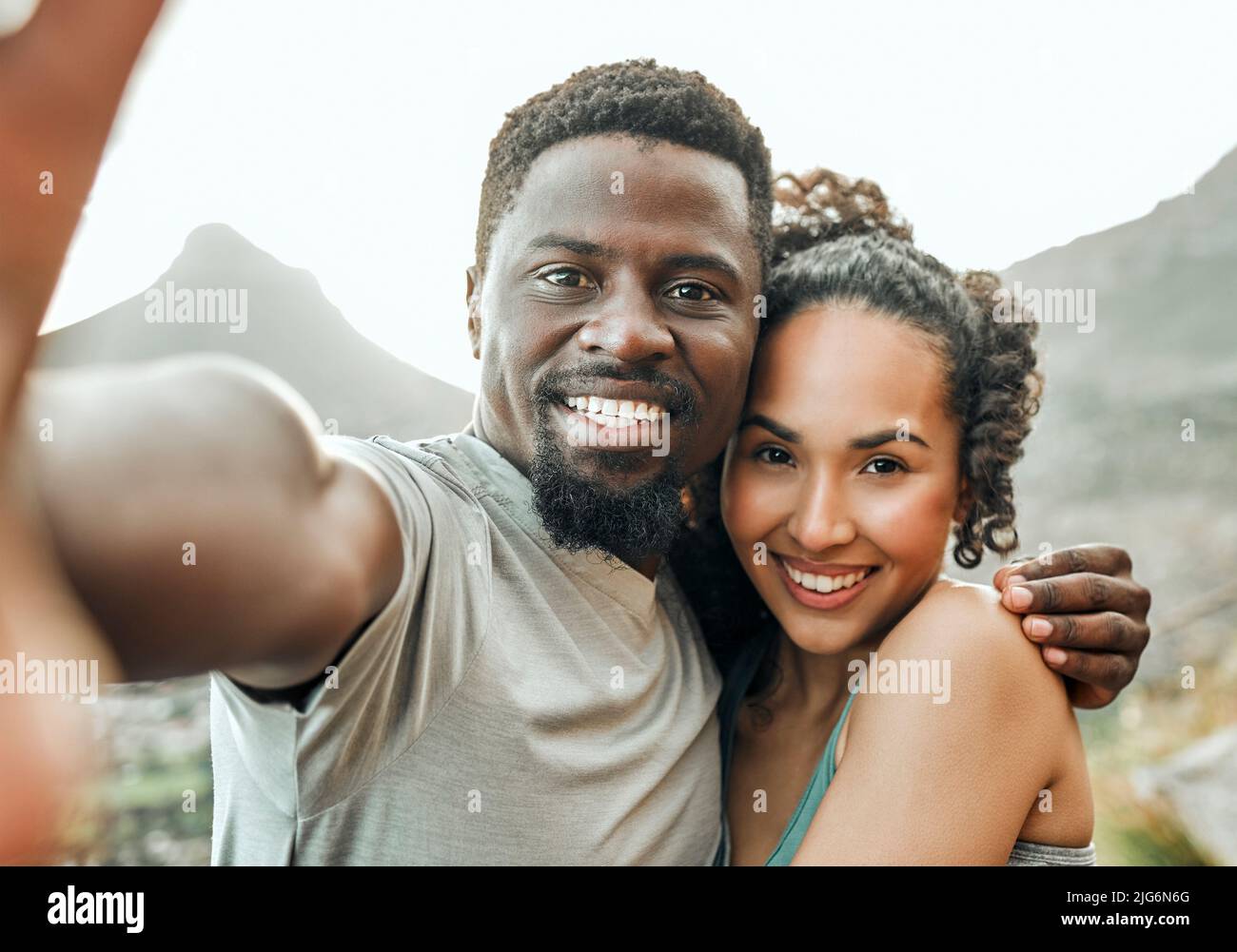 I love having you around. Shot of two friends taking selfies during a workout. Stock Photo