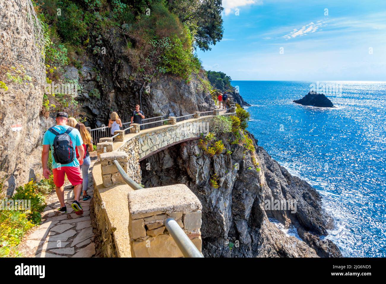 Tourists walking the trail from Monterosso al Mare to Vernazza in Cinque Terre, Italy Stock Photo