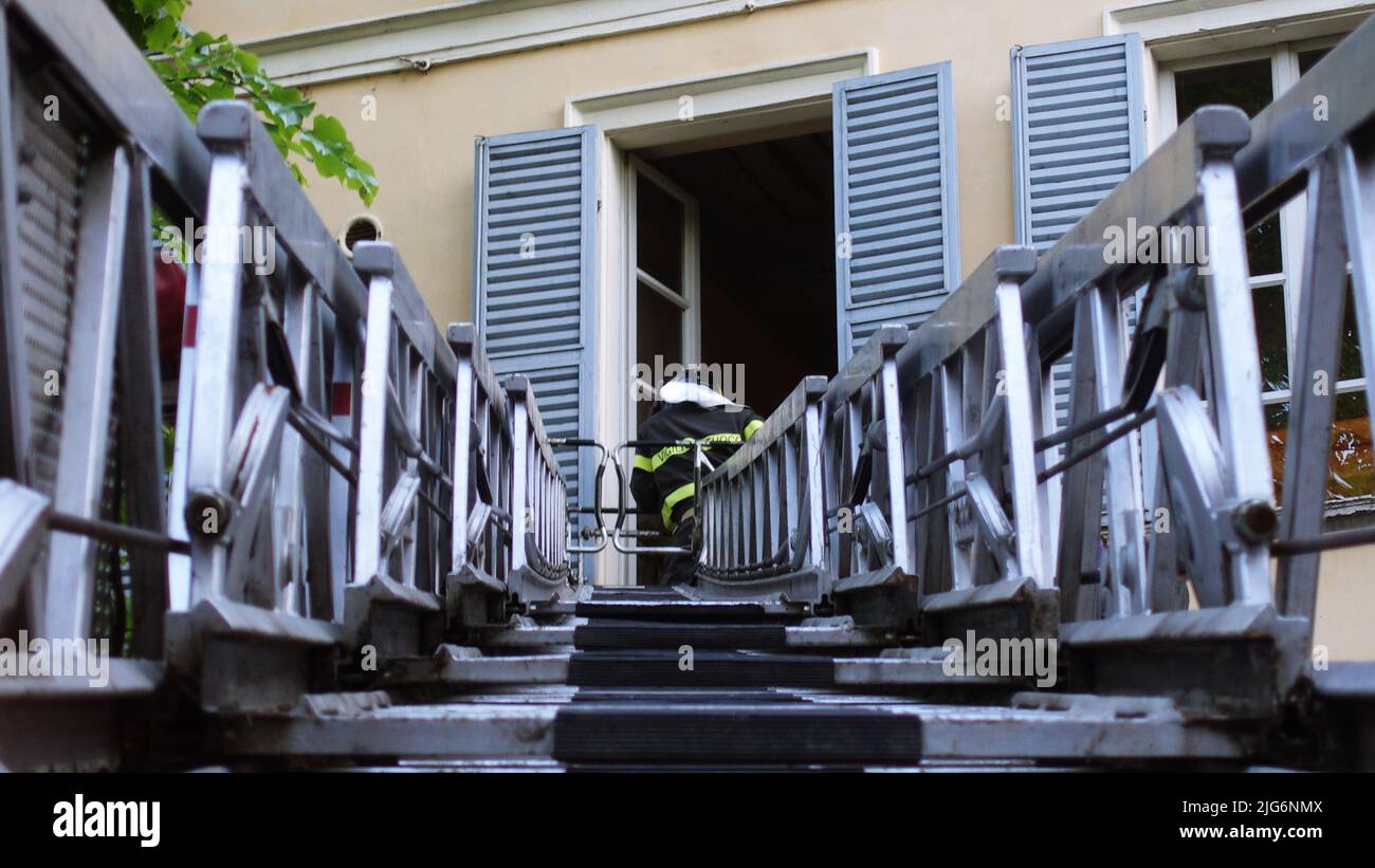 The firefighters' extendable ladder called a ladder truck in extension