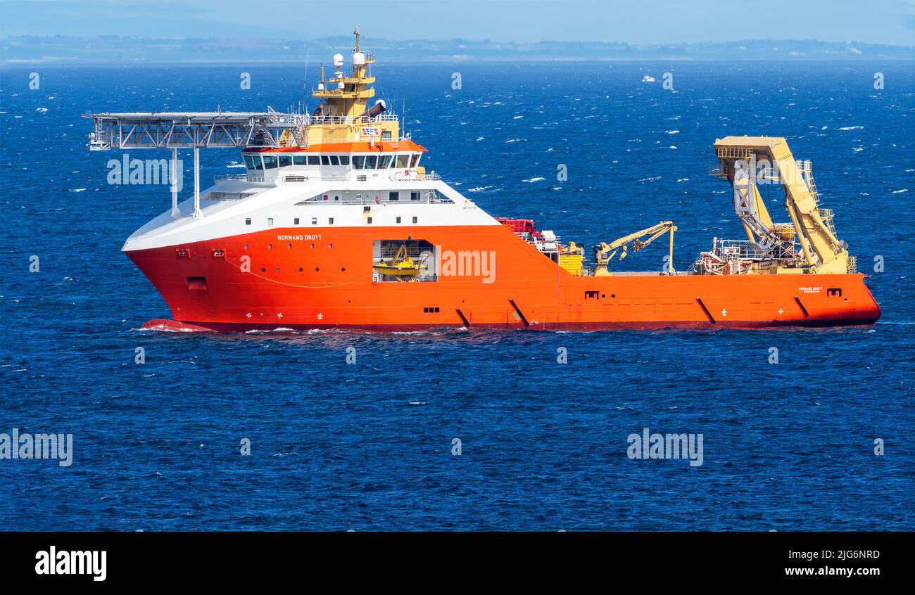 NORMAND DROTT is a Tug/Supply Vessel that was built in 2010 and is sailing under the flag of Norway approaching the Scottish coast. Stock Photo