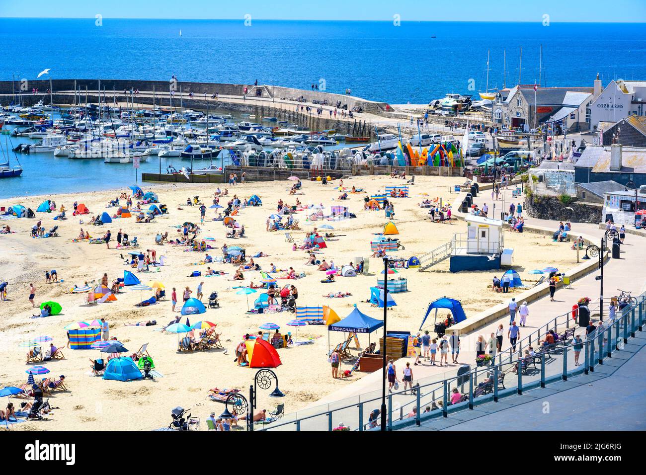 Lyme Regis, Dorset, UK. 8th July, 2022. UK Weather Beachgoers flock to