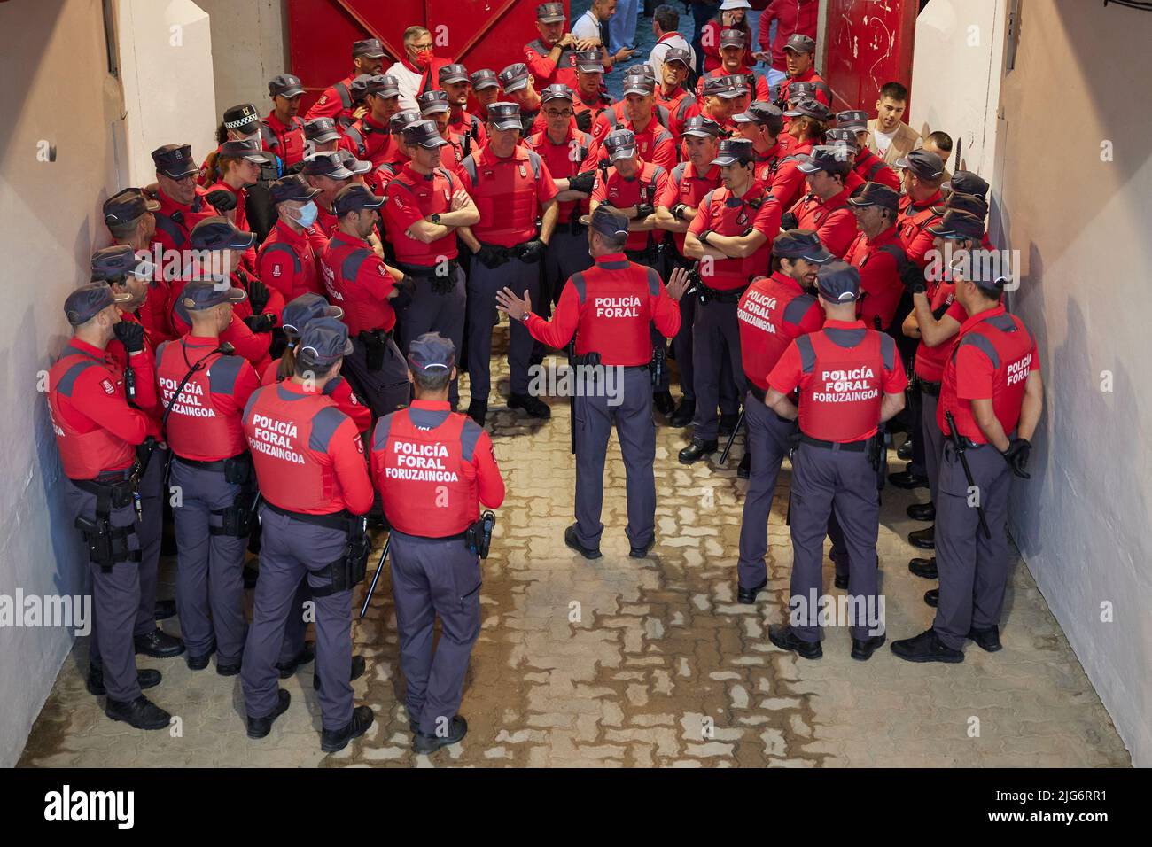 Navarre police during the second day of running of the bulls at the San Fermin Festival in Pamplona, northern Spain, on July 8, 2022. Revelers from all over the world flock to Pamplona every year to participate in the eight days of bullfighting. Made famous by American writer Ernest Hemmingway's 1926 novel 'The Sun Also Rises', the annual San Fermin Festival involves the daily running of the bulls through the historic heart of Pamplona to the bullring  (Photo by Ruben Albarran / PRESSINPHOTO) Stock Photo