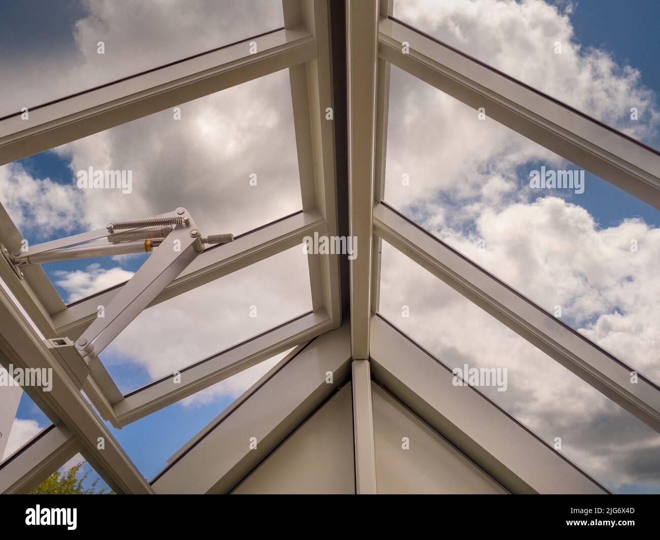 Greenhouse interior with an automatic ventilation window Stock Photo