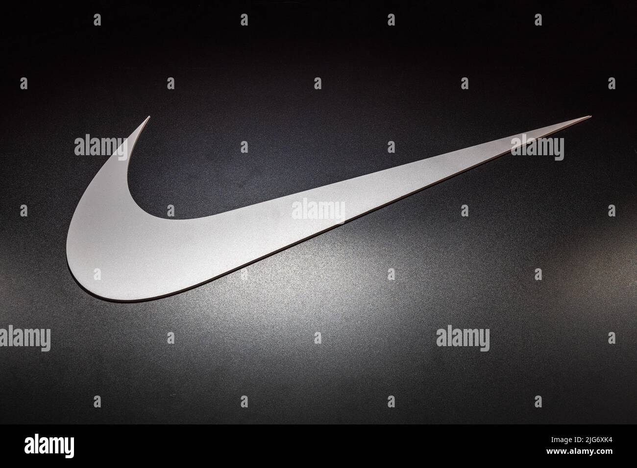 Nike logotype logo sign on the wall of the store. Kaunas, Lithuania, 22 June 2022 Stock Photo