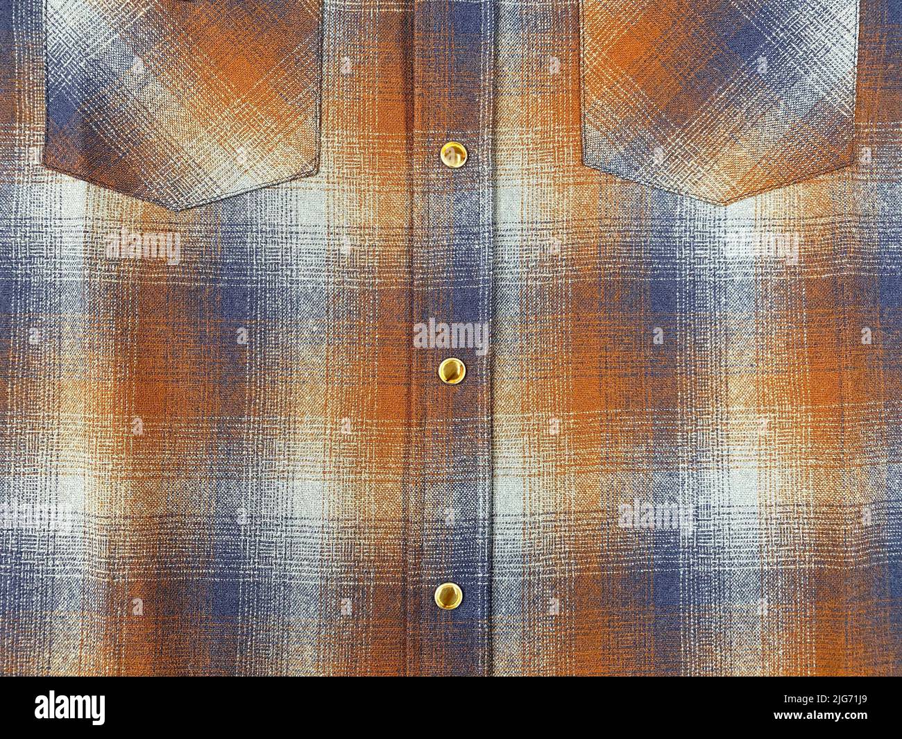 Shirt pockets. Shirt chest pocket close up. Plaid shirt. Fabric clothes. Part of a shirt from wool fabric. Stock Photo