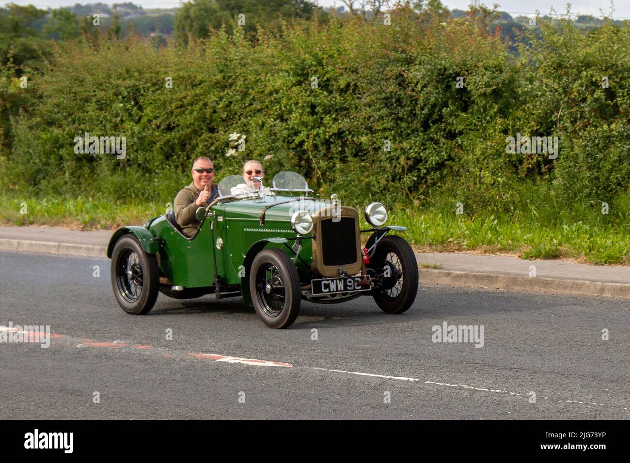1936 30s thirties green Austin Seven 750cc petrol cabrio, en-route to Hoghton Tower for the Supercar Summer Showtime car meet which is organised by Great British Motor Shows in Preston, UK Stock Photo