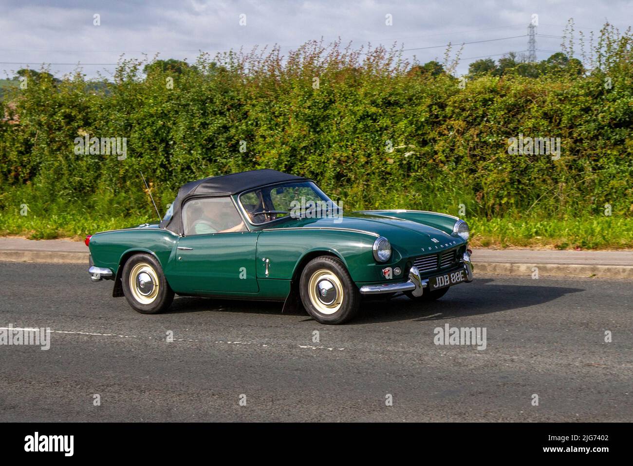 1967 60s sixties green Triumph Spitfire Mk2 1147cc Ptrol sports car; en-route to Hoghton Tower for the Supercar Summer Showtime car meet which is organised by Great British Motor Shows in Preston, UK Stock Photo