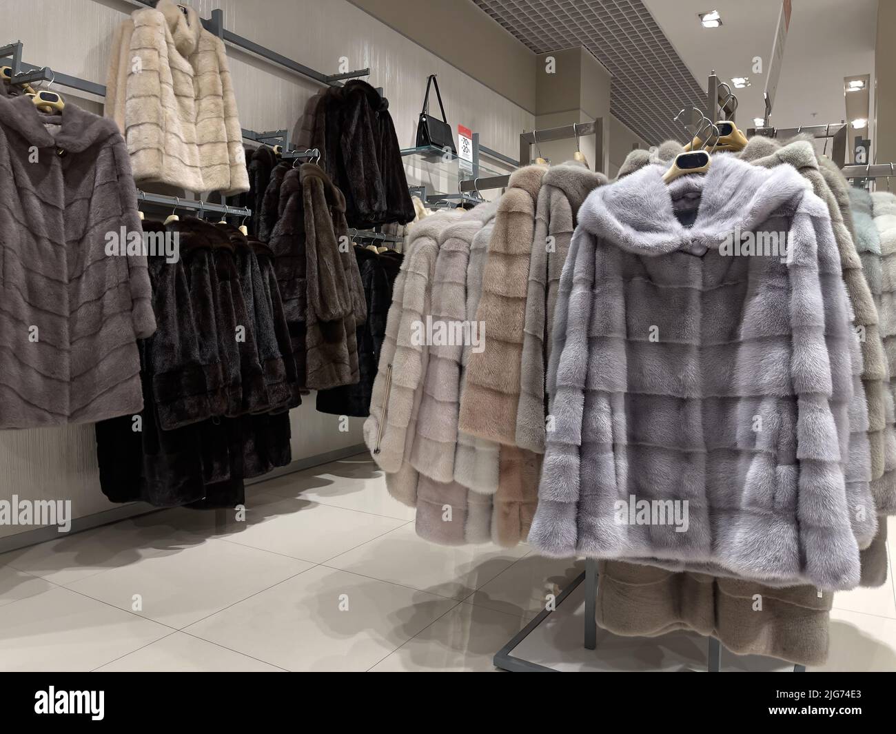 Fur coats for women in the shop display Stock Photo Alamy