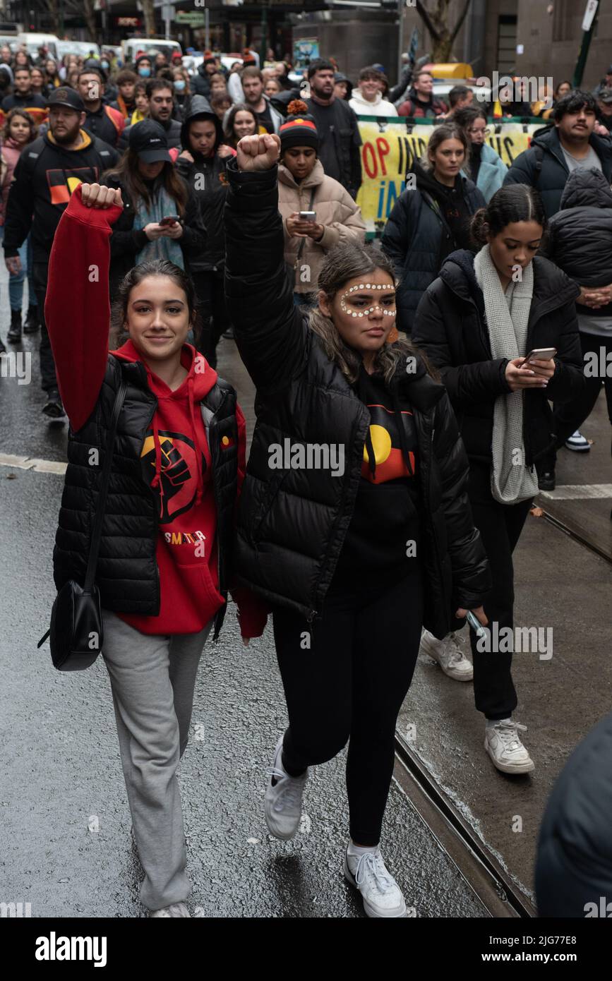 Melbourne, Australia. 8th July 2022. Protesters hold up their fists during a march through Melbourne, celebrating NAIDOC week. Credit: Jay Kogler/Alamy Live News Stock Photo