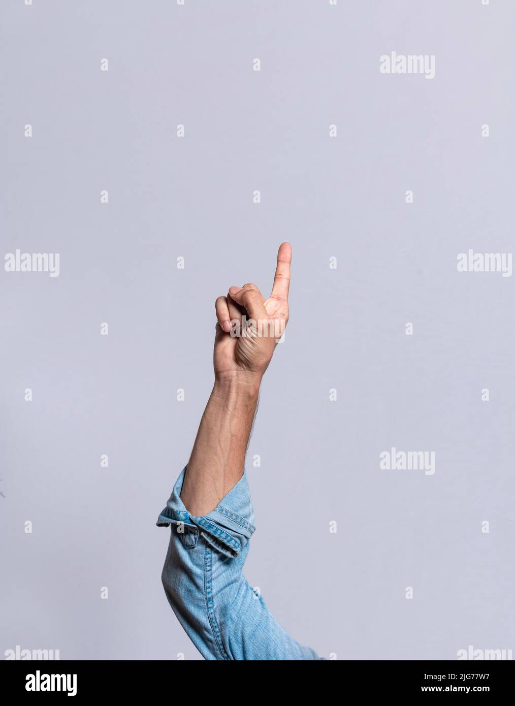 Hand counting number one, Boy hand showing number one, Guy finger counting number one on isolated background Stock Photo