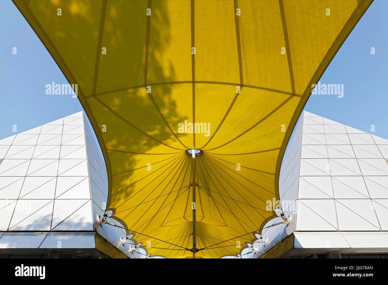 Yellow awning with shadow of a tree, modern architecture, Duesseldorf Airport, North Rhine-Westphalia, Germany Stock Photo