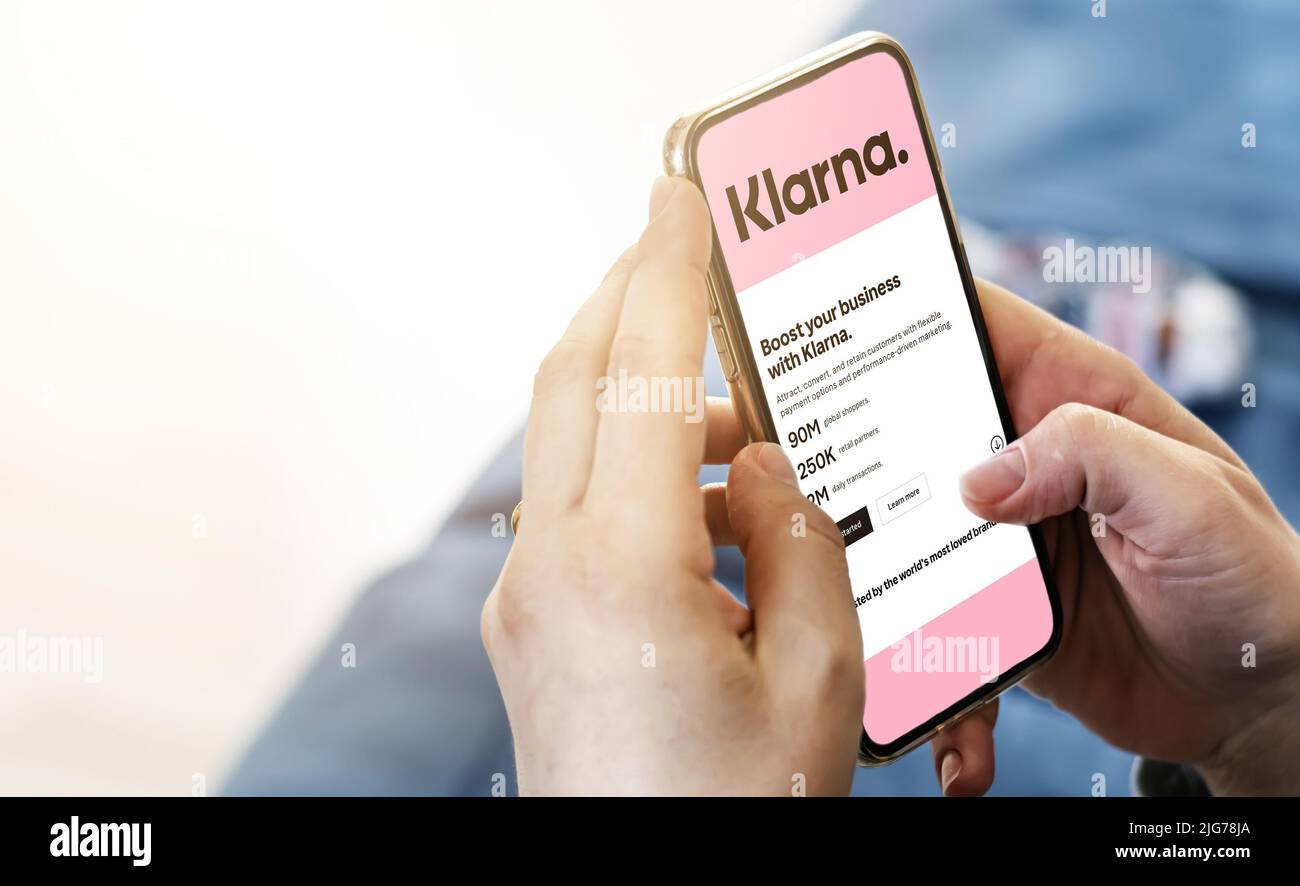 San Francisco, CA, US, July 2022: Female hands holding a phone with Klarna company web page on screen. Klarna is the largest private fin-tech start-up Stock Photo