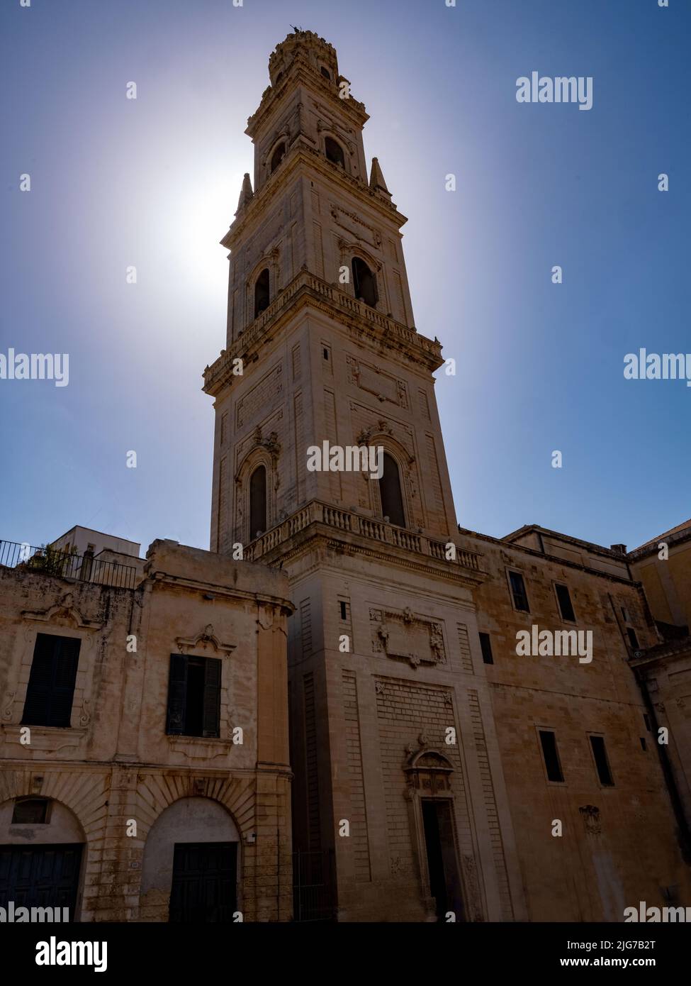 Morning sunlight behind the bell tower of the Duomo of Lecce, Puglia, Italy on a hot summer day Stock Photo