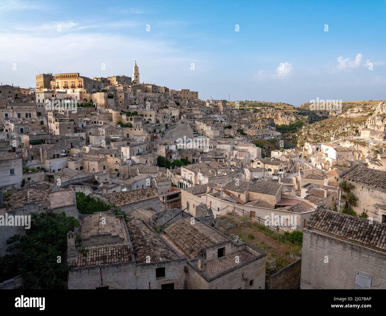 Panoramic view of the sassi or old city of Matera, Basilicata, Italy with its cathedral and cave houses built into the surrounding hills. Stock Photo