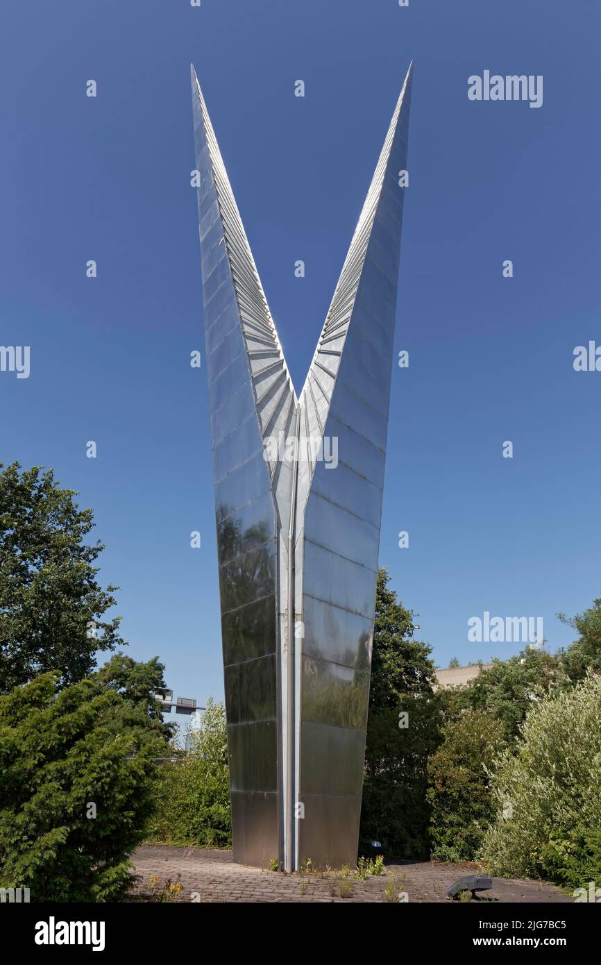 Abstract sculpture made of stainless steel, V-shape, pylon by sculptor Max Kratz, Duesseldorf Airport, North Rhine-Westphalia, Germany Stock Photo