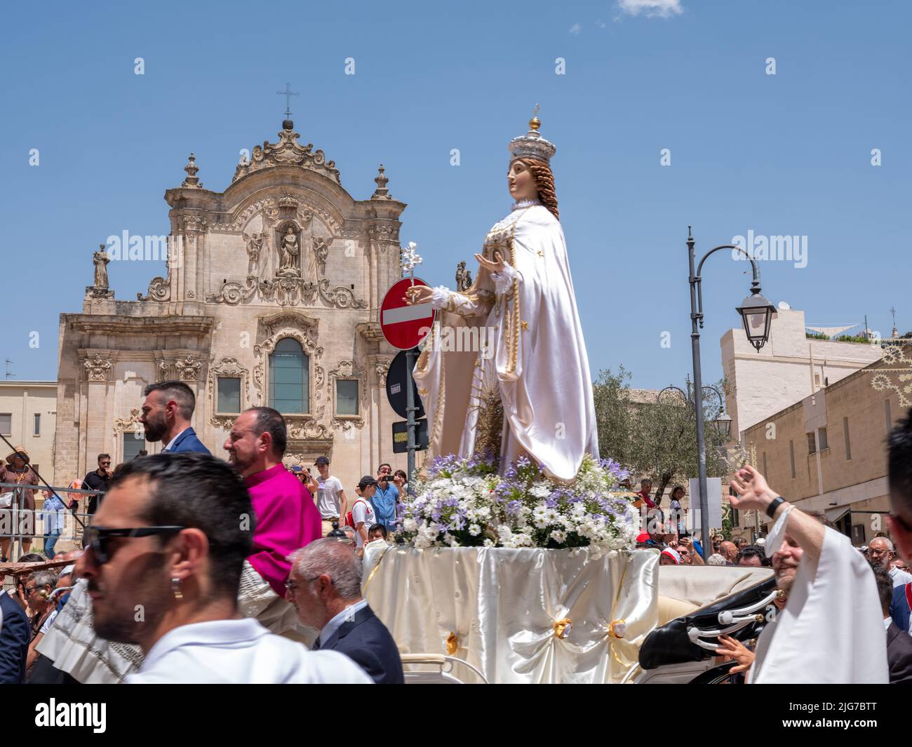 The initial procession of the statue of the Brown Madonna in Matera, Italy, in a horse carriage attended by a local Catholic bishop dressed in purple. Stock Photo