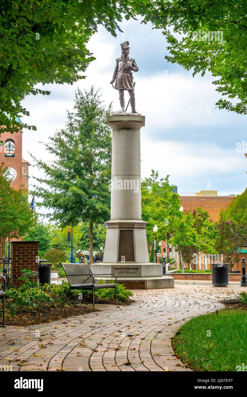 Statue of the Daniel Morgan Monument stands tall in downtown Spartanburg, South Carolina along a brick sidewalk. Stock Photo