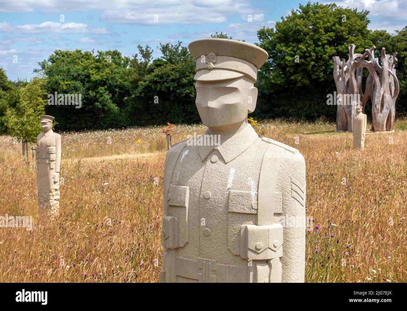 The Regiment of Trees (2017-2019) and Witness (2016-2021) sculptures at Langley Vale Centenary Wood in Epsom, Surrey, England, UK Stock Photo