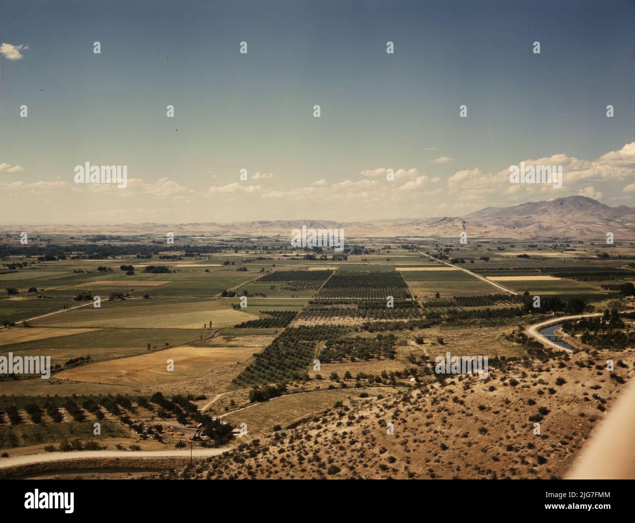 Cherry orchards, farm lands and irrigation ditch at Emmett, Idaho Stock