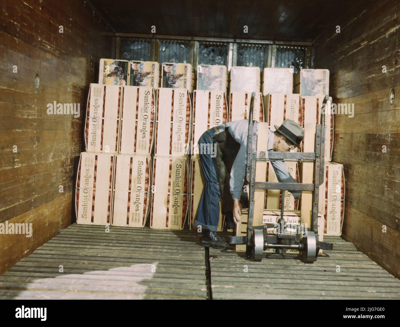 Loading oranges into a refrigerator car at a co-op orange packing plant, Redlands, Calif. Santa Fe R.R. trip. Stock Photo
