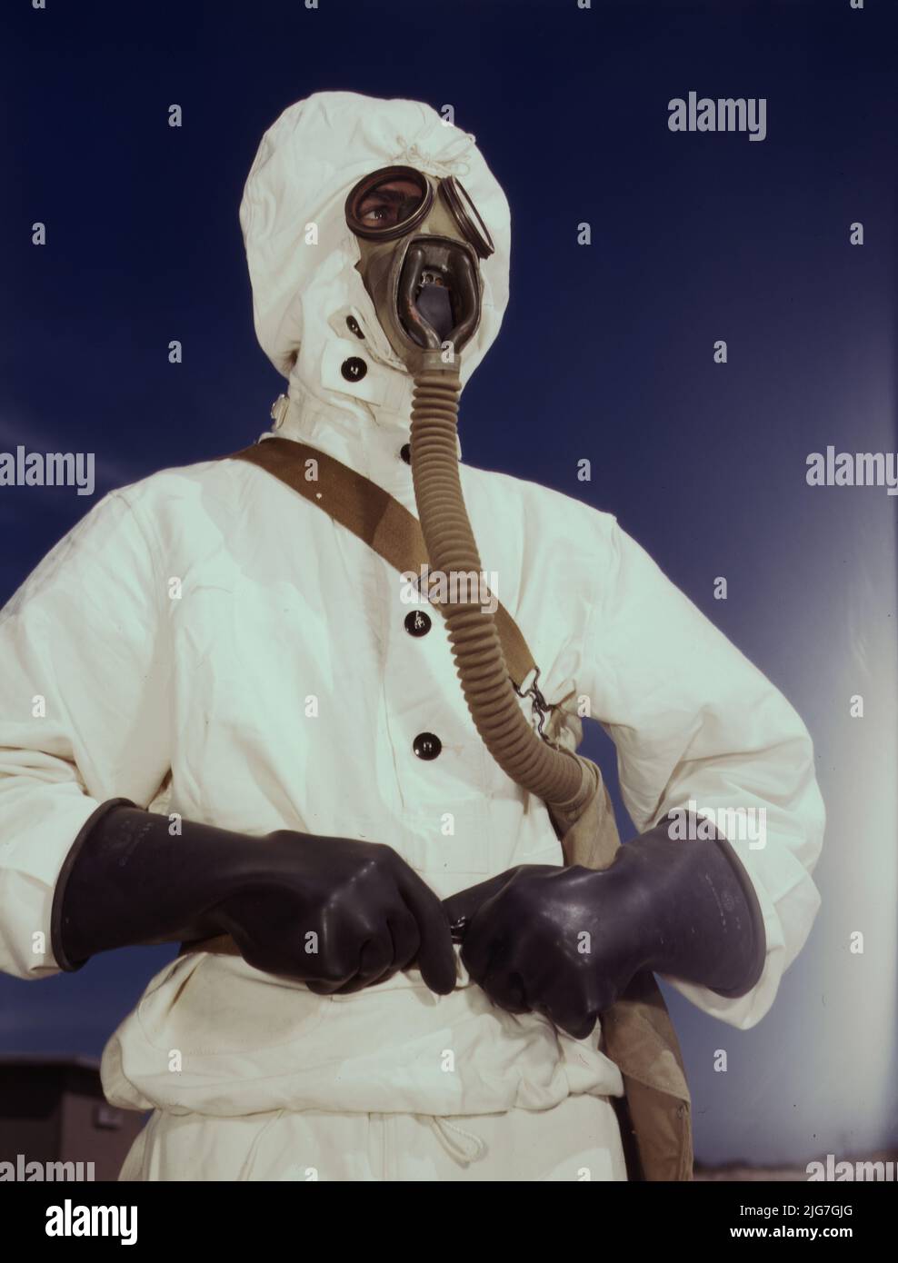 Sailor at the Naval Air Base wears the new type protective clothing and gas mask designed for use in chemical warfare, Corpus Christi, Texas. These uniforms are lighter than the old type. Stock Photo