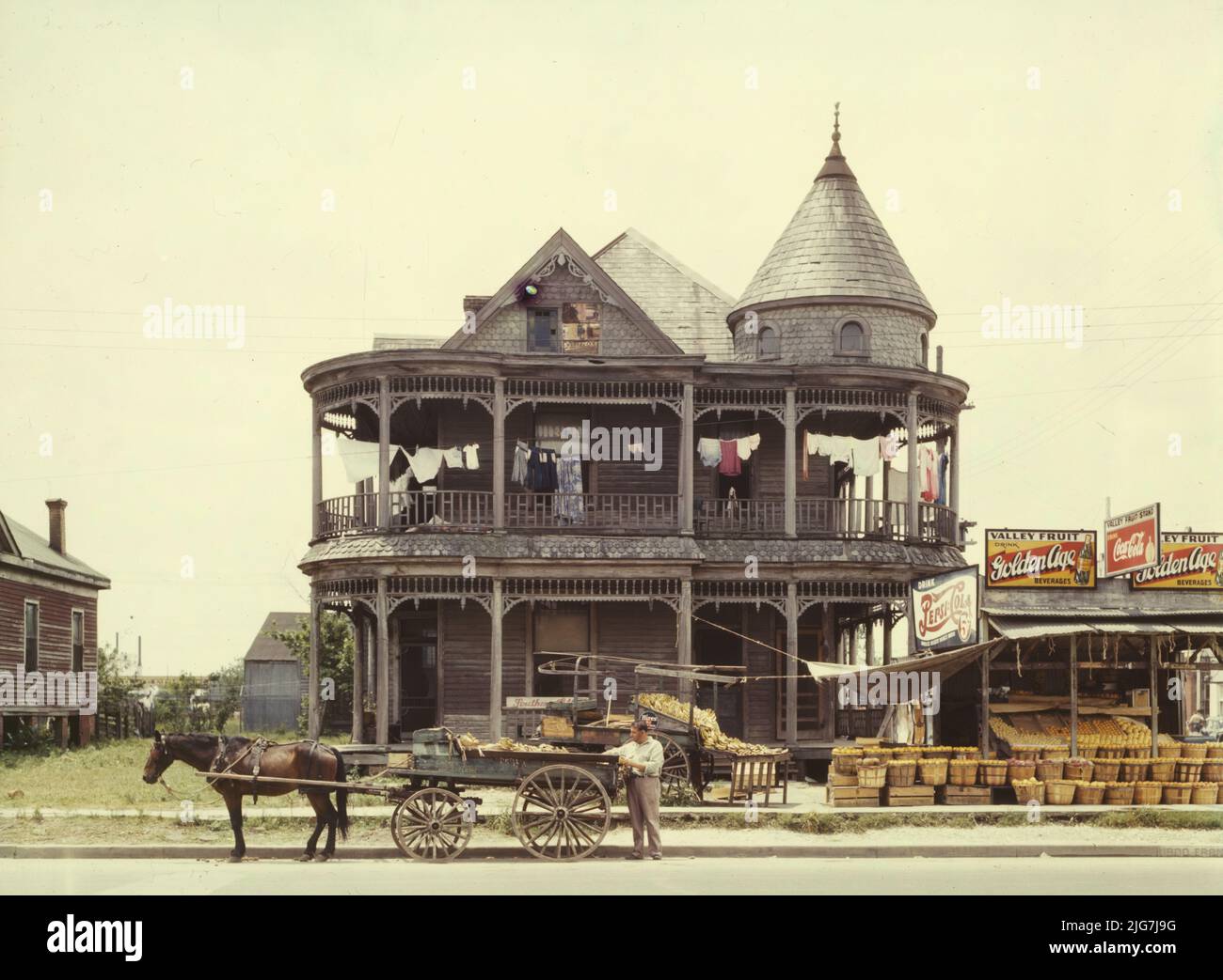 House, Houston, Texas. [Fruit stall. Signs advertising PepsiCola and