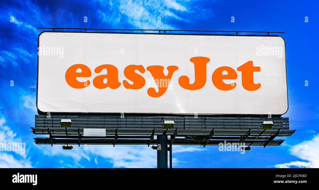 POZNAN, POL - JUN 23, 2022: Advertisement billboard displaying logo of EasyJet, a British low-cost airline group headquartered at London Luton Airport Stock Photo