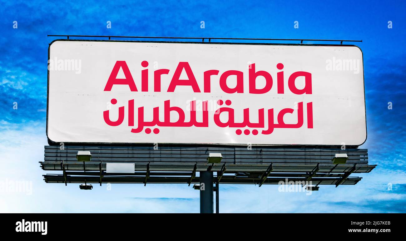POZNAN, POL - JUN 23, 2022: Advertisement billboard displaying logo of Air Arabia, an Emirati low-cost airline Stock Photo