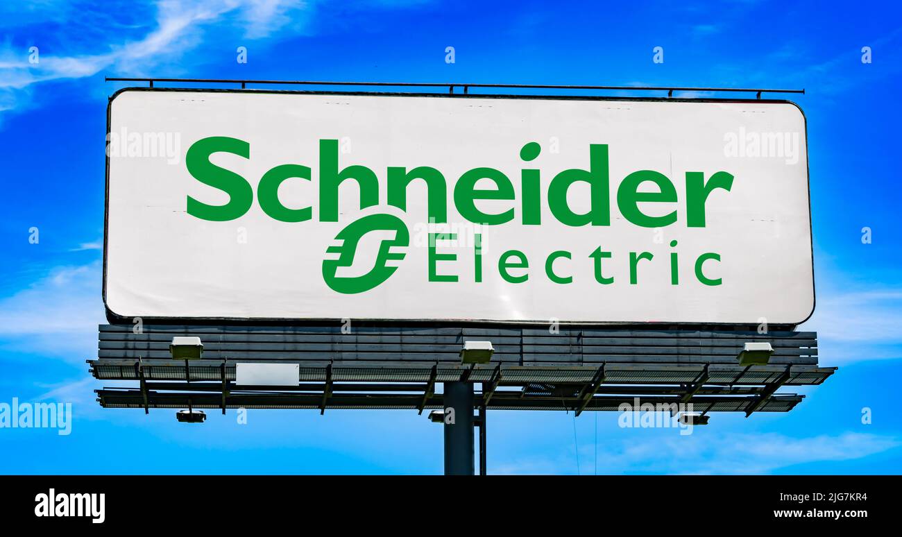 POZNAN, POL - JUN 28, 2022: Advertisement billboard displaying logo of Schneider Electric, a French multinational company that specialises in digital Stock Photo