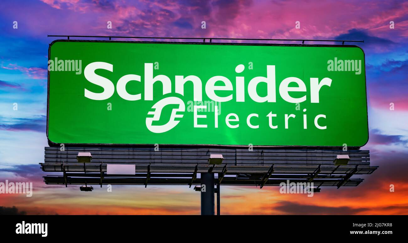 POZNAN, POL - JUN 28, 2022: Advertisement billboard displaying logo of Schneider Electric, a French multinational company that specialises in digital Stock Photo