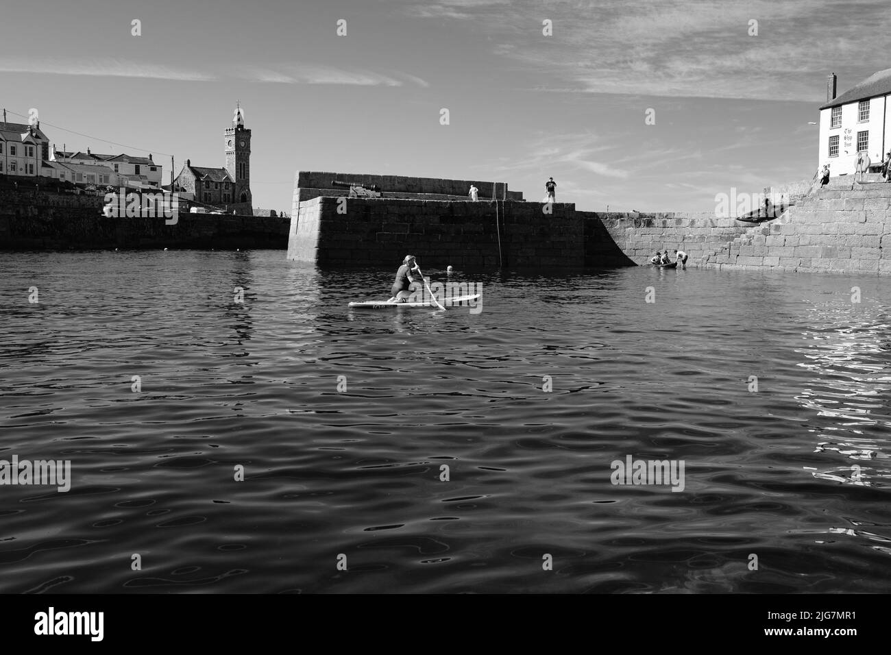 Fishing Boats entering and leaving harbour at Porthleven, Cornwall Stock Photo