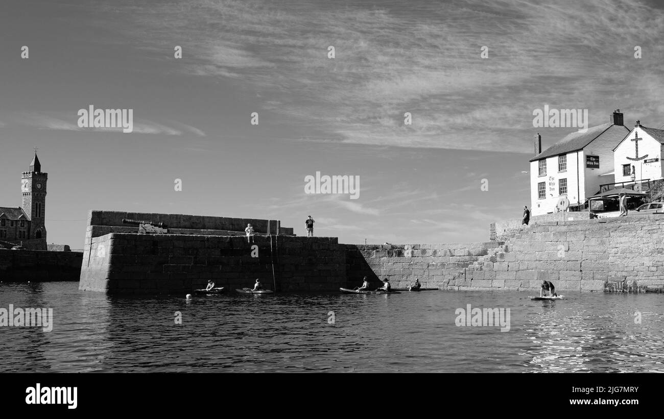 Fishing Boats entering and leaving harbour at Porthleven, Cornwall Stock Photo