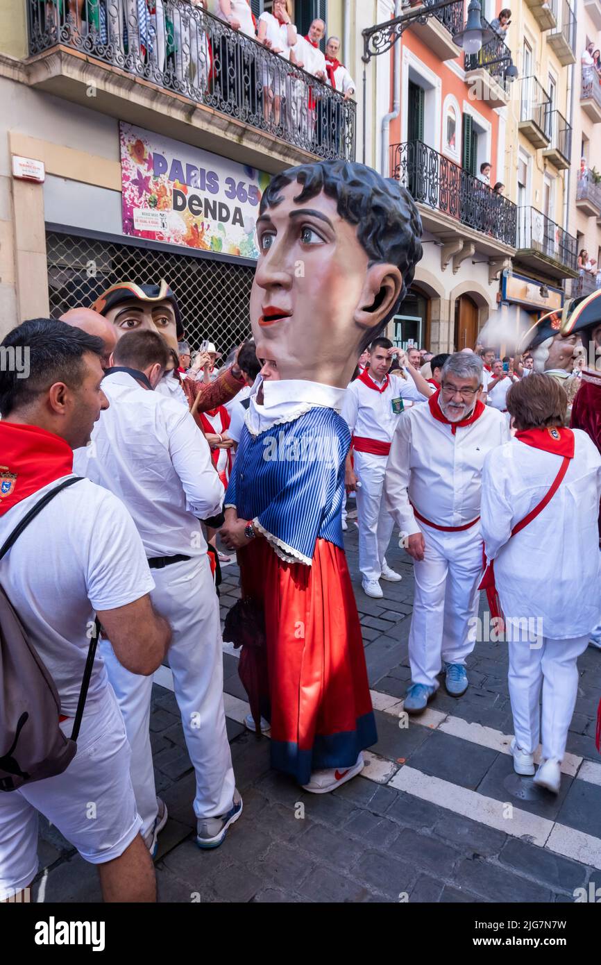 big heads in the procession of the day of San Fermin. July 07, 2022. High Street. Pamplona, Navarra, Spain, Europe. Stock Photo