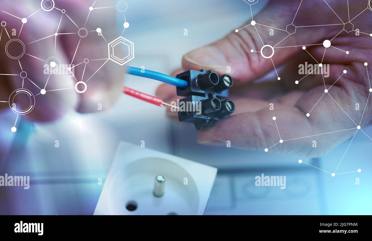 Electrician hands connecting wires in terminal block; light effect