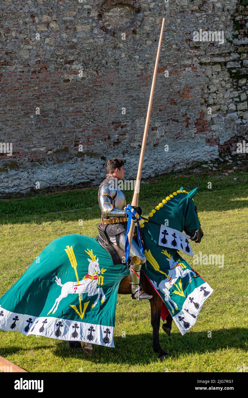WYWAR CASTLE FEST, demonstrations of knightly fights Knight on a horse with a spear, waiting for an opponent Stock Photo